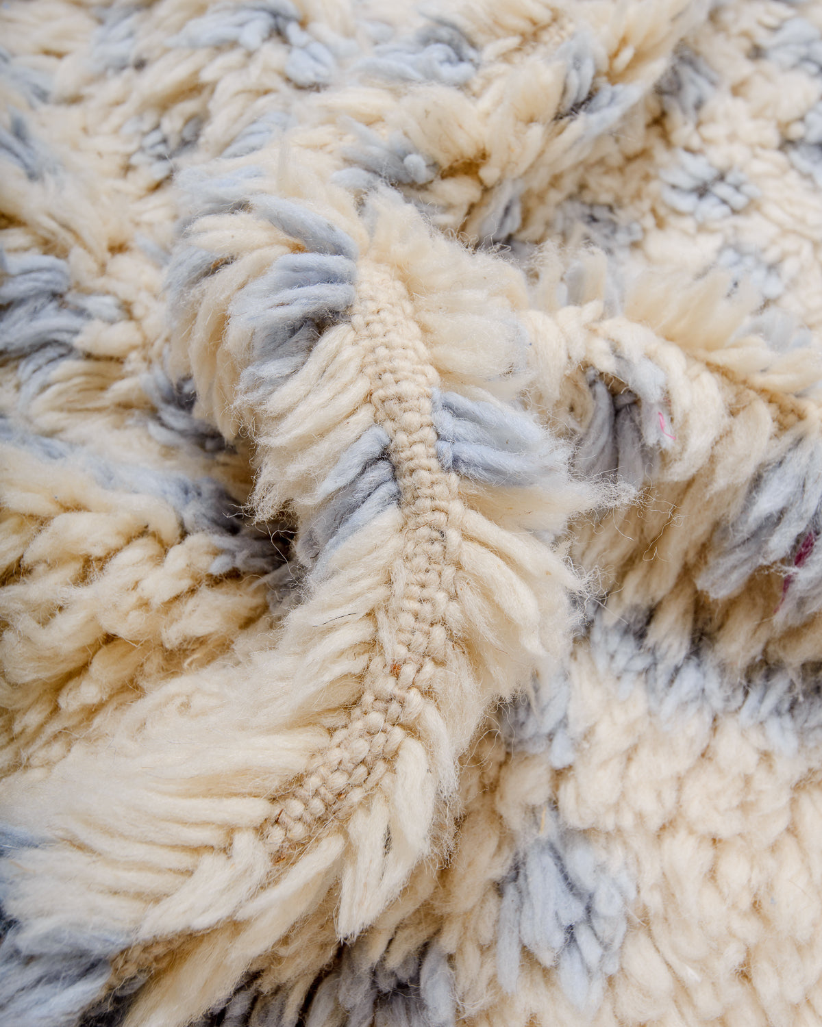 Detail of fluffy Azilal rug showing the spacing of the rows and the density of the wool pile.