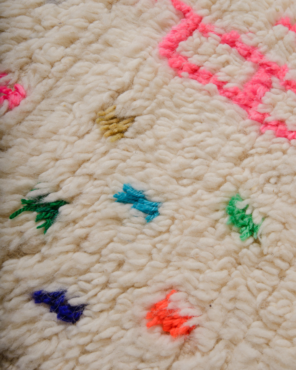 Detail of Azilal rug showing the fluffy wool texture and cotton colours.
