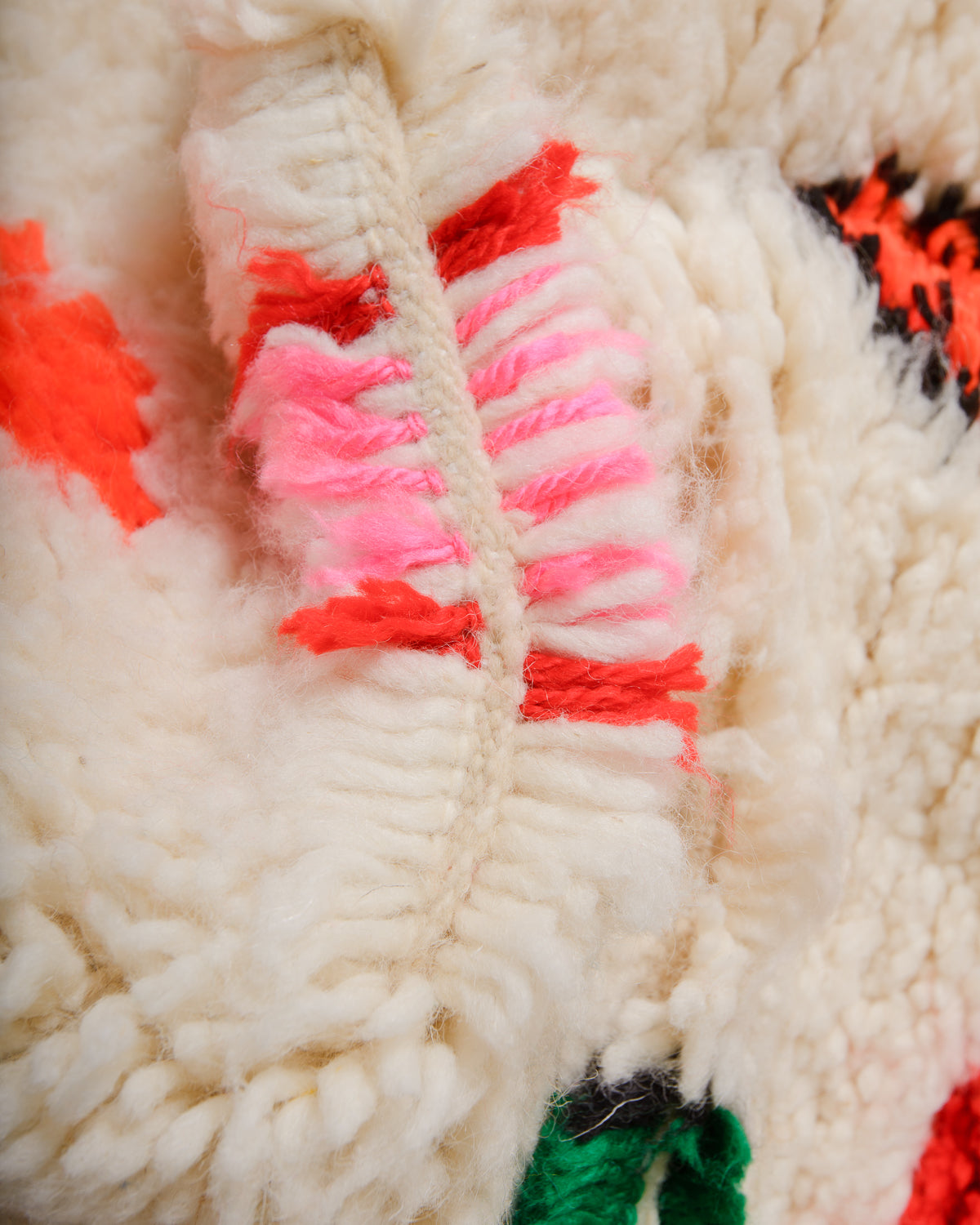 Detail of Azilal rug showing the spacing of the knotted wool rows and fluffy wool texture.