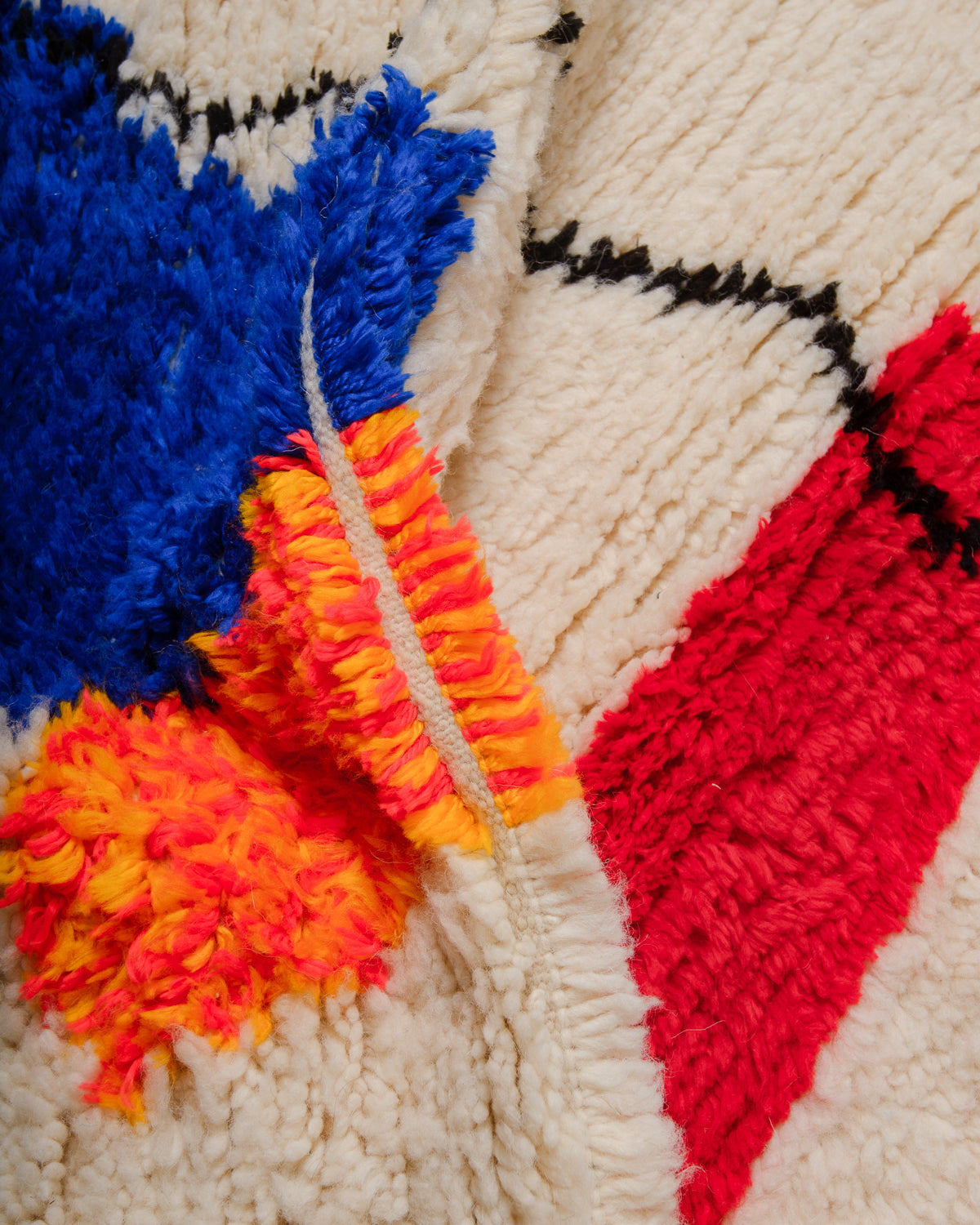 Detail of Azilal rug showing the spacing of the knotted rows and fluffy texture of the wool and soft cotton.