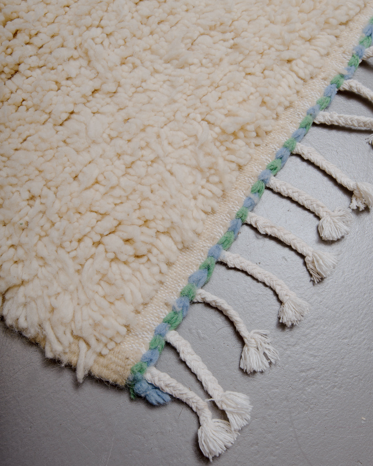 Corner of azilal rug with cotton tassels. 