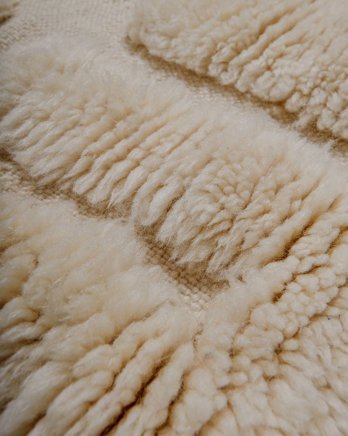 Close-up of a textured wool rug surface