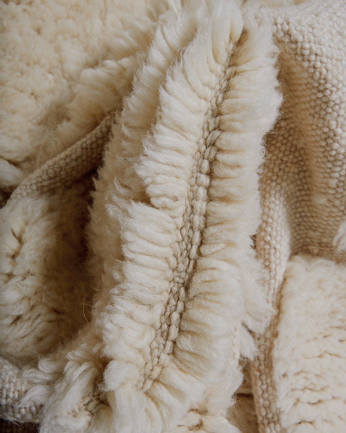 Close-up of dense cream wool rug
