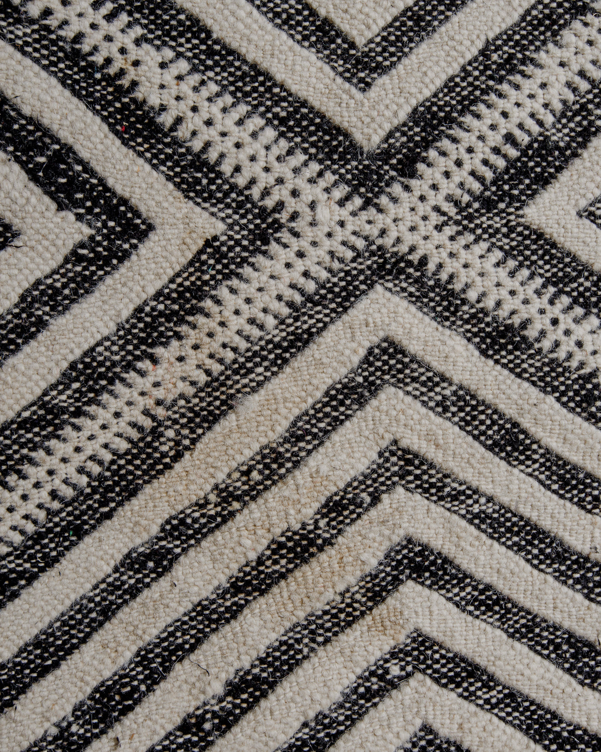 Close up of surface of rug showing area of discolouration.