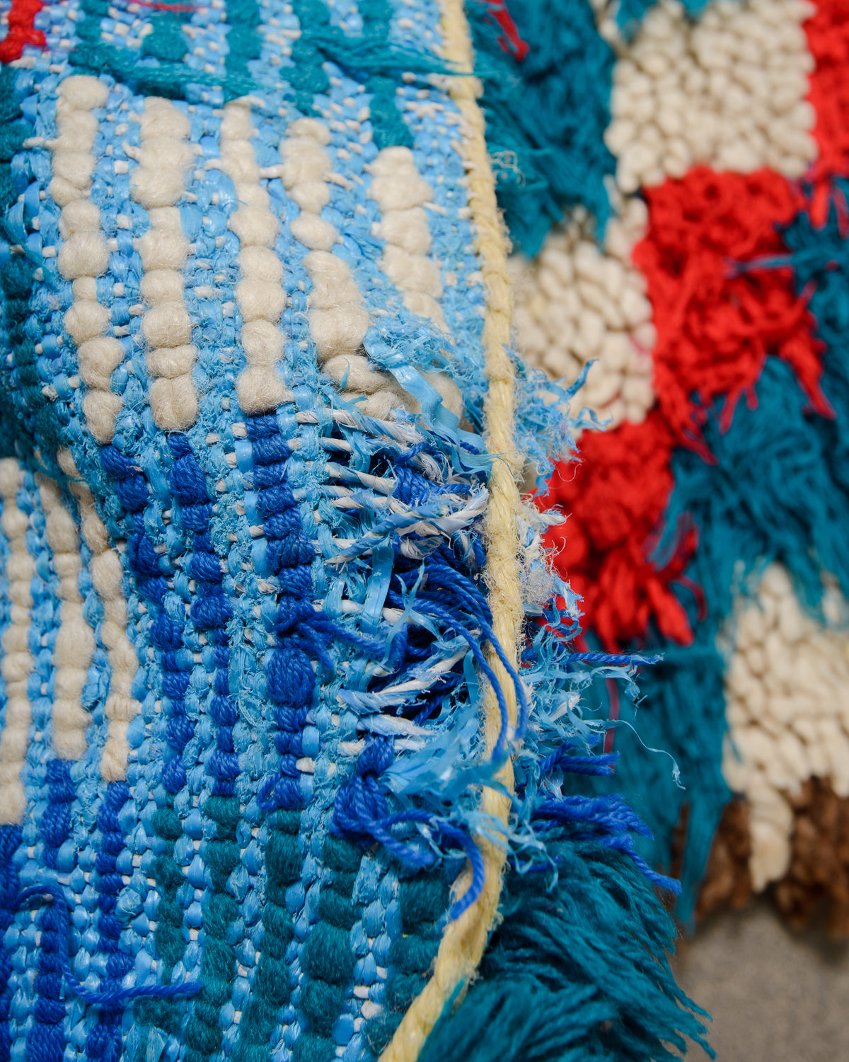 Detail of hole at end of rug.