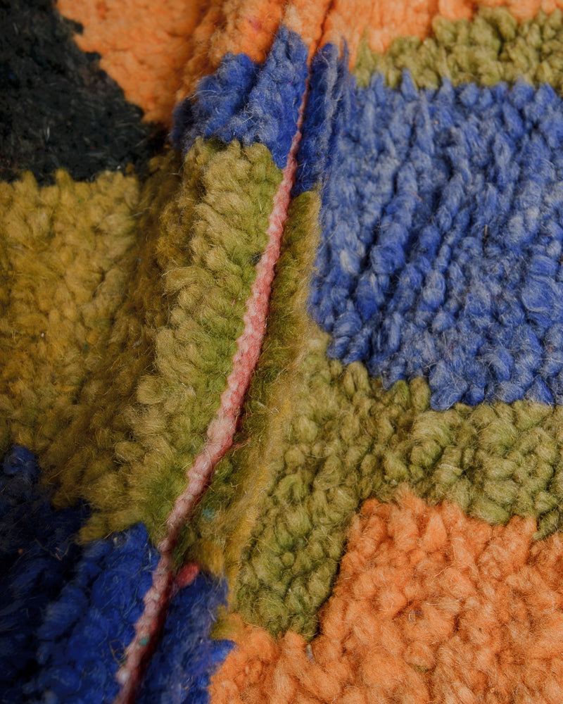 Close up of vintage wool rug showing density of wool pile. 