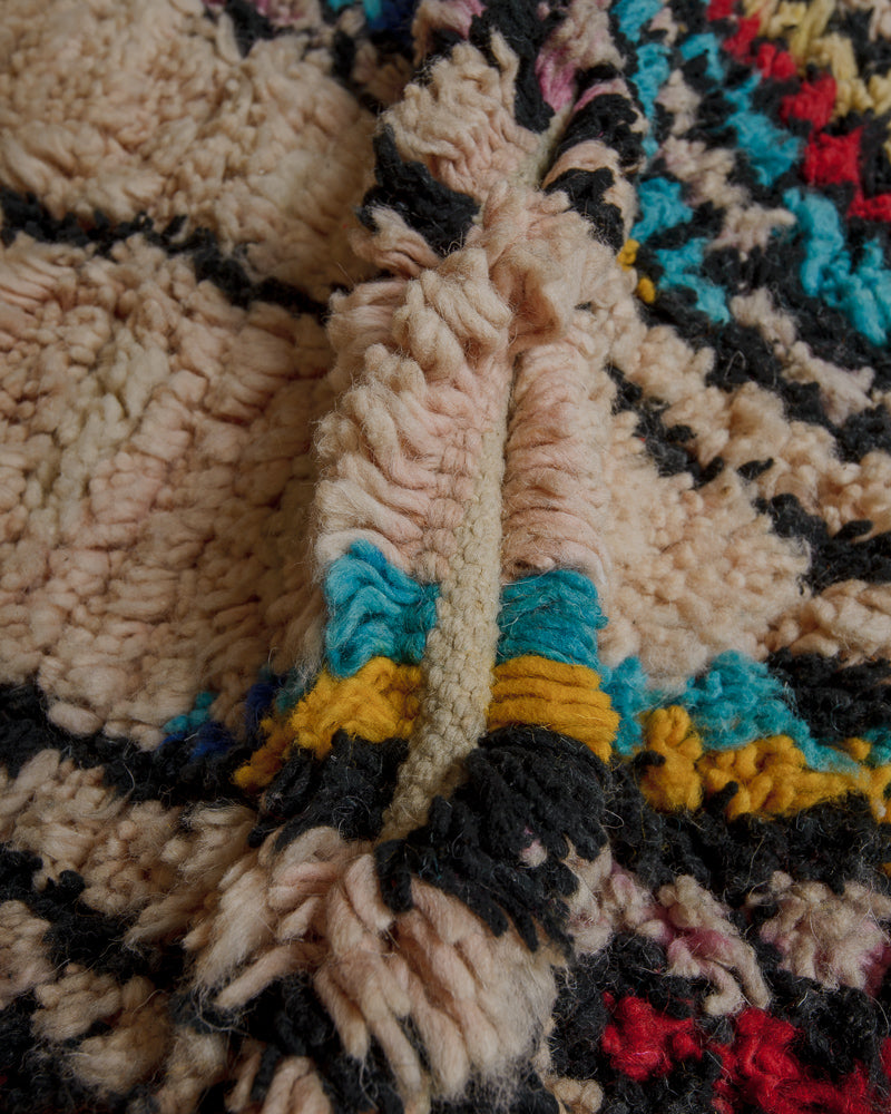 Close up of vintage boujaad rug showing length of pile and wefted rows.