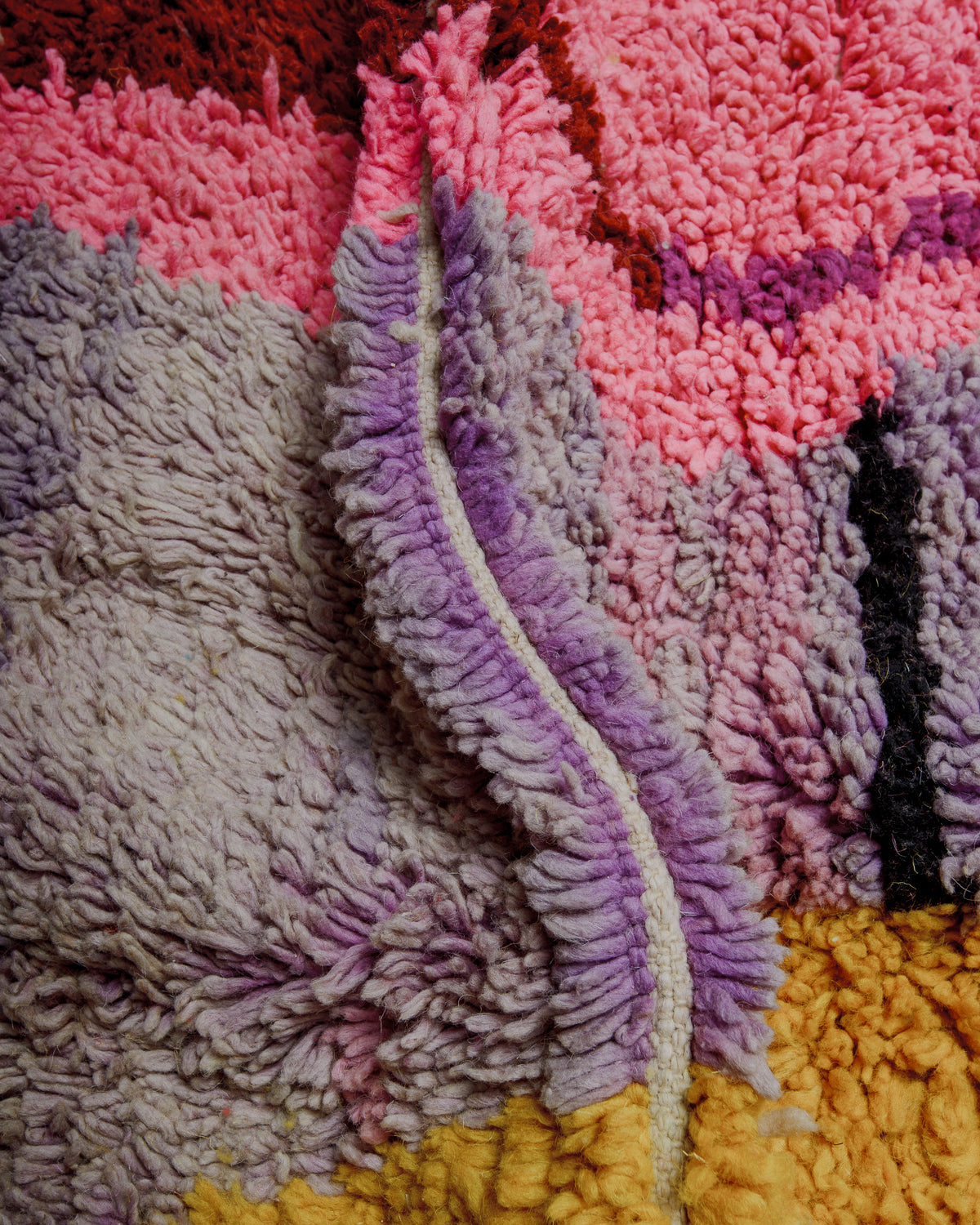 Close up of vintage boujaad rug showing length of pile and wefted rows.
