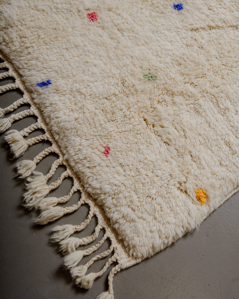 Edge of Berberlin finest rug with natural wool tassels. 