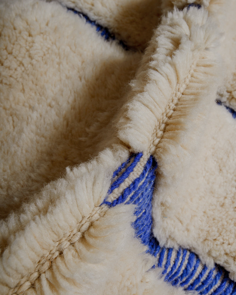 Close up of wool rug showing thick pile. 