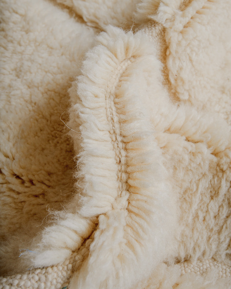 Close up of wool rug showing thick pile. 