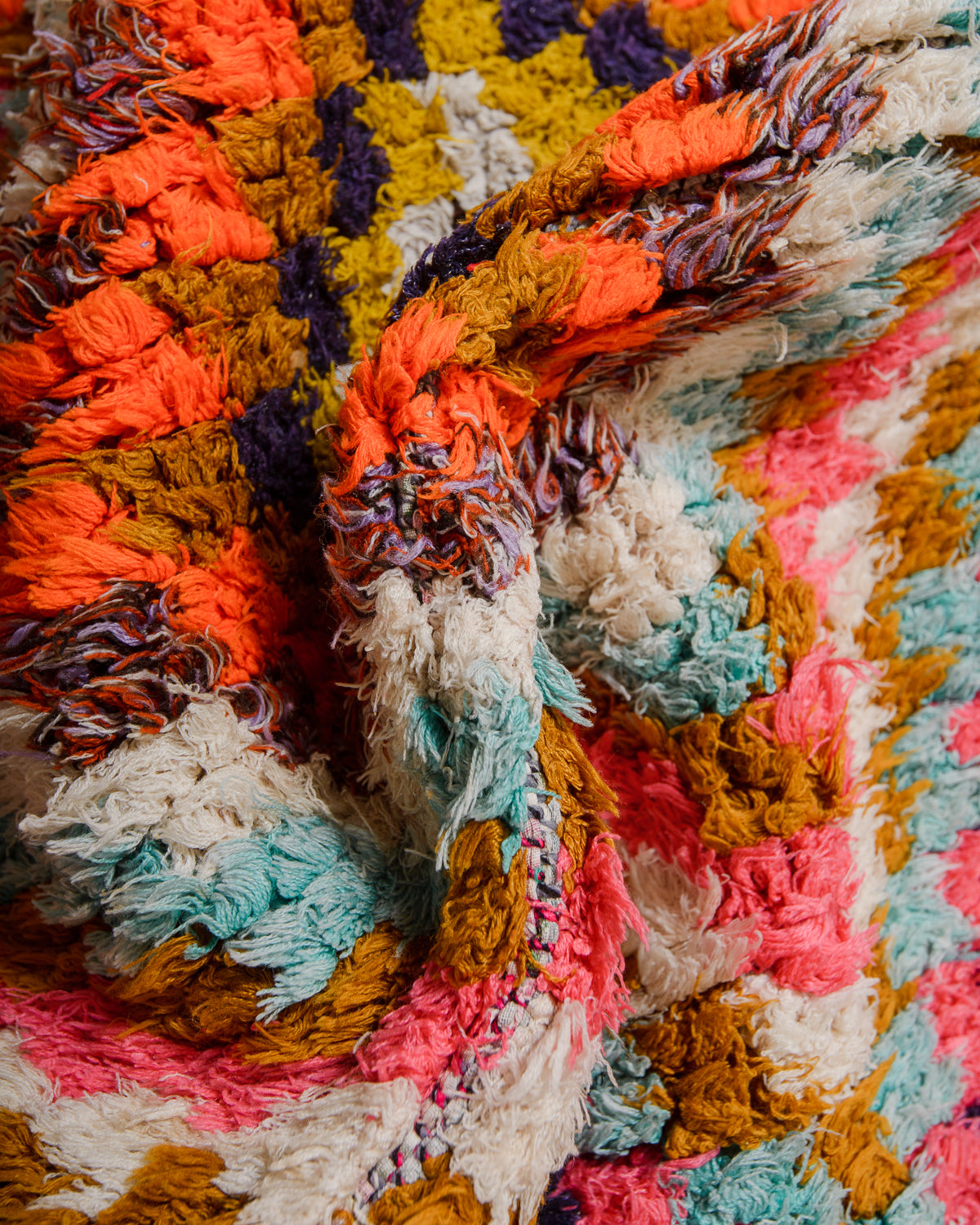 Close-up of a colorful textured fabric with multicolor pattern
