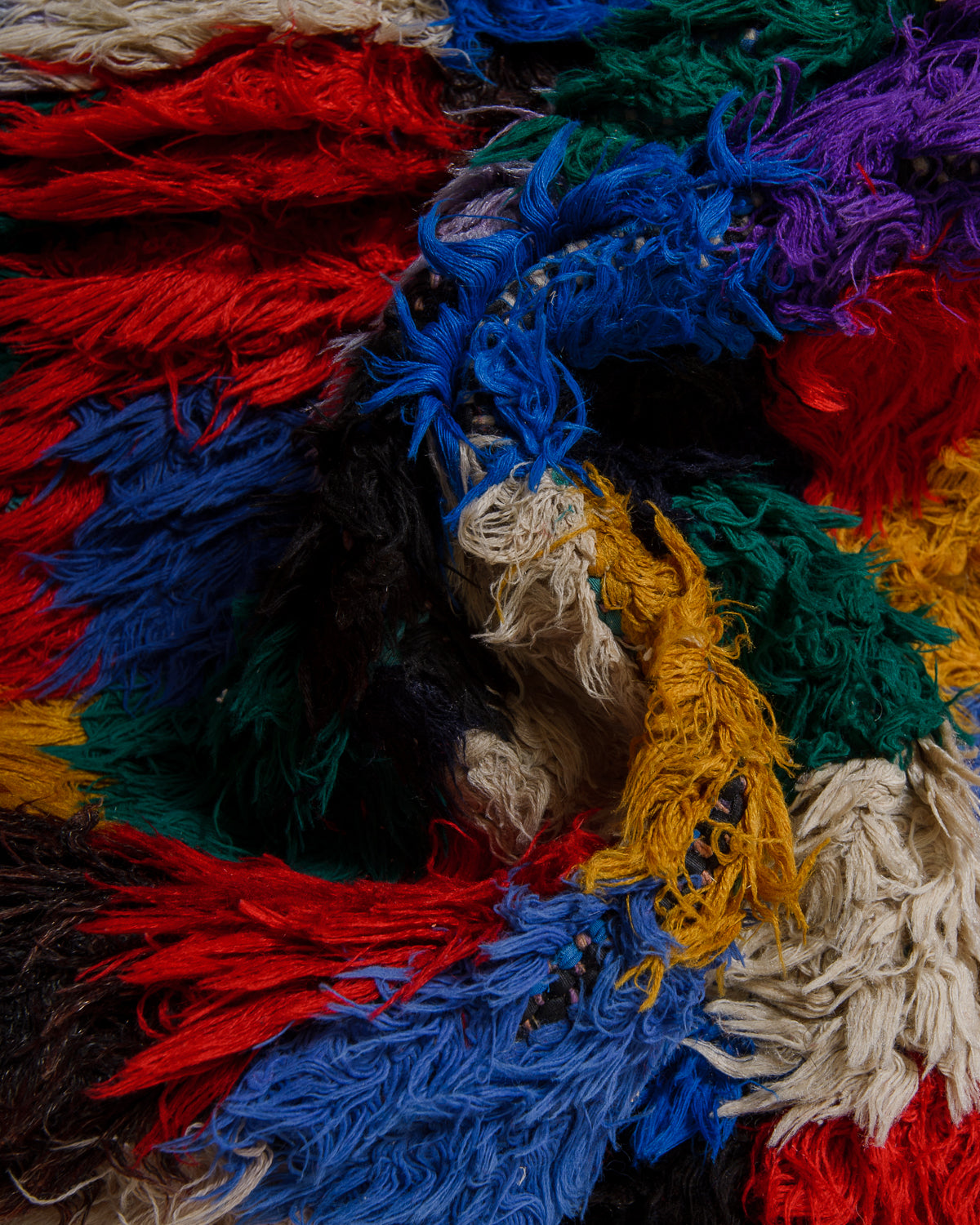 Close-up of colorful cotton in red, blue, green, yellow, and white.