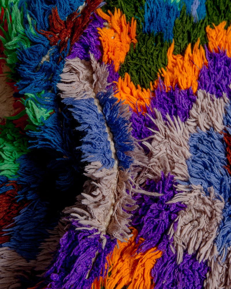Close up of rug made of recycled cotton remnants in bright colours.