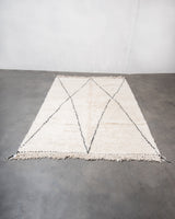 Modern, designer, handcrafted Berber rug from Morocco. Beniourain carpet with minimalist design, natural wool pile and a fluffy texture.
