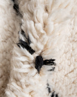 Modern, designer, handcrafted Berber rug from Morocco. Beniourain carpet with minimalist design, natural wool pile and a fluffy texture.