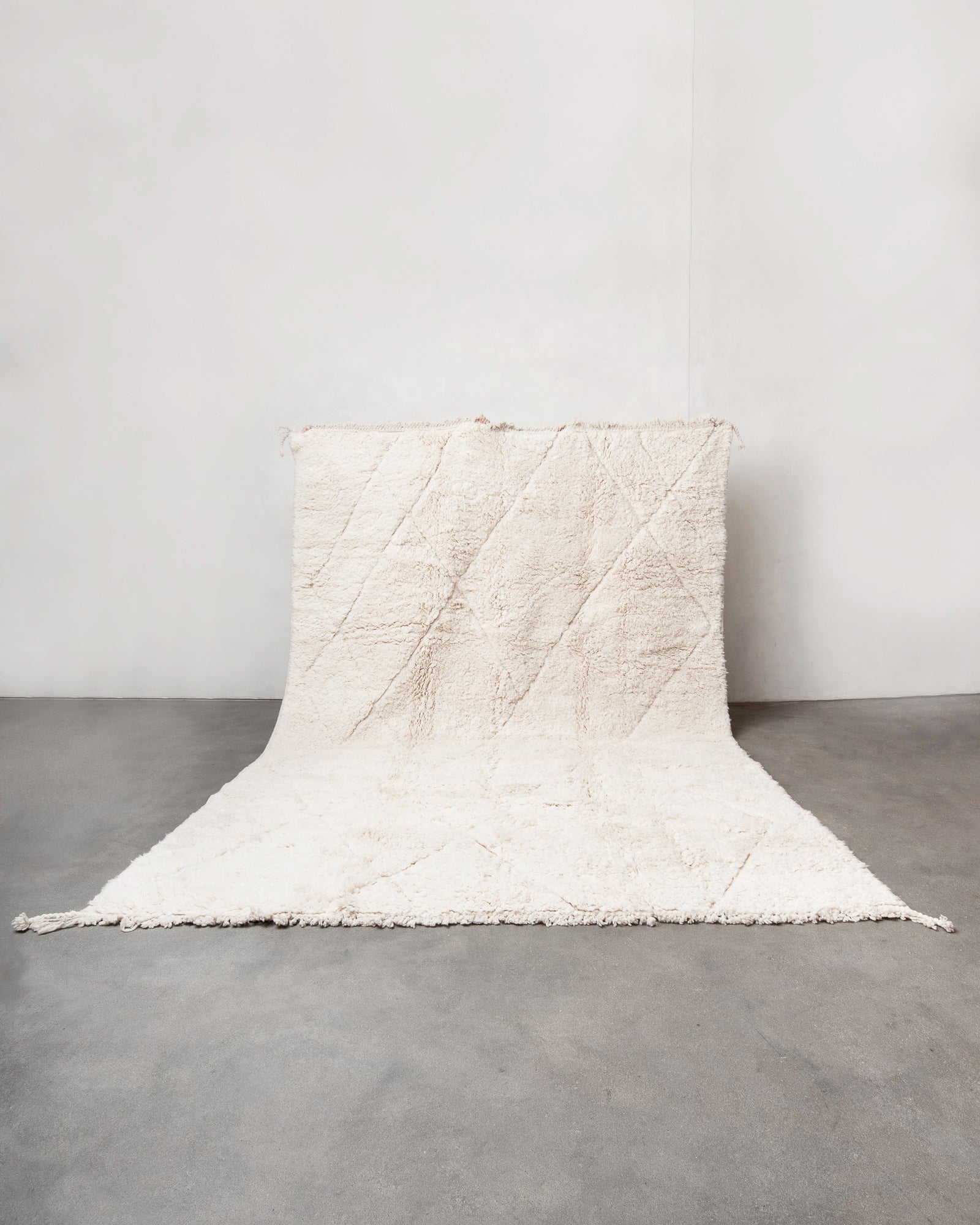 Modern, designer, handcrafted Berber rug from Morocco. Beniourain carpet with minimalist design, natural wool pile and a fluffy texture.