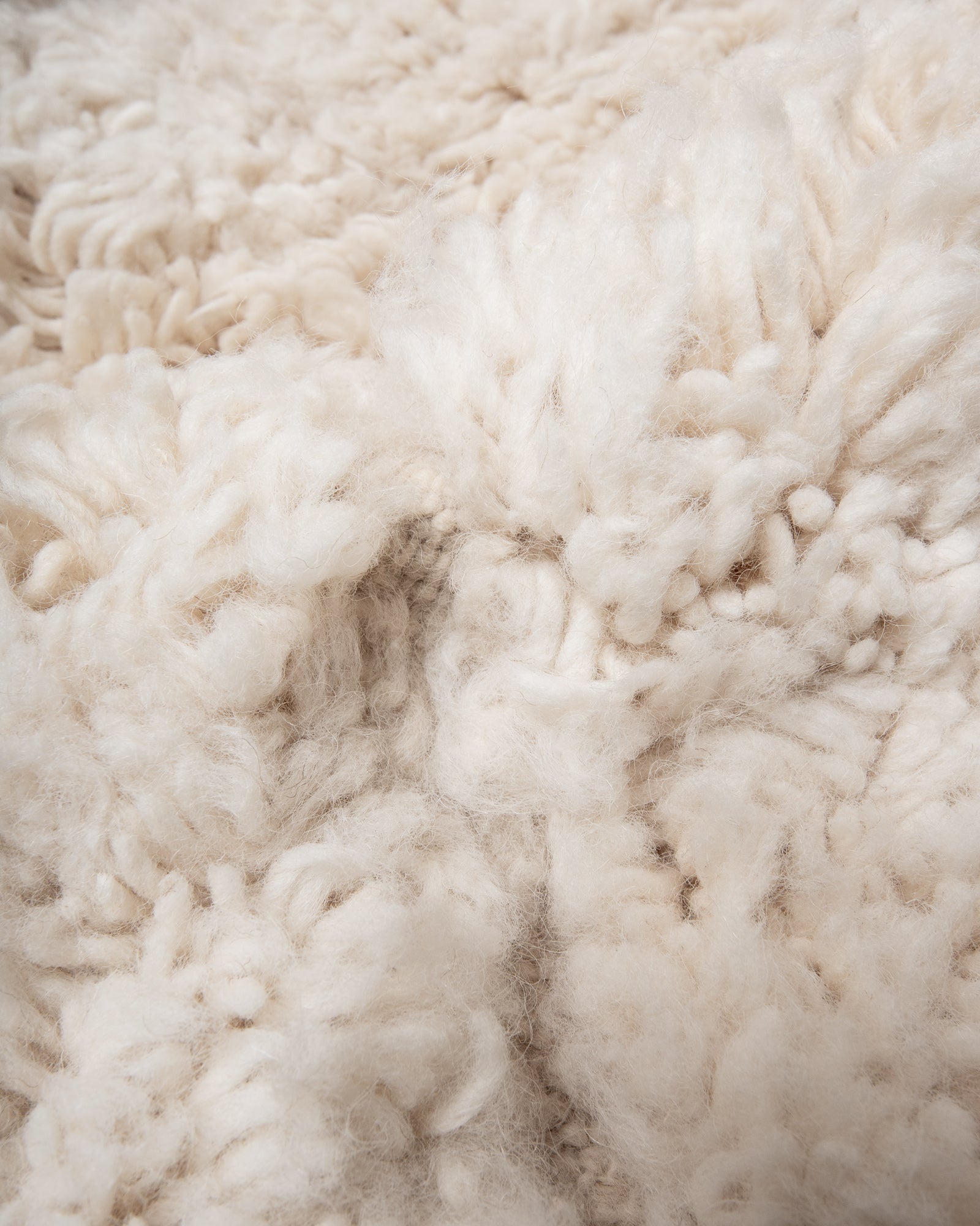 Modern, designer, handcrafted Berber rug from Morocco. Beniourain carpet with minimalist design, natural wool pile and a fluffy texture.