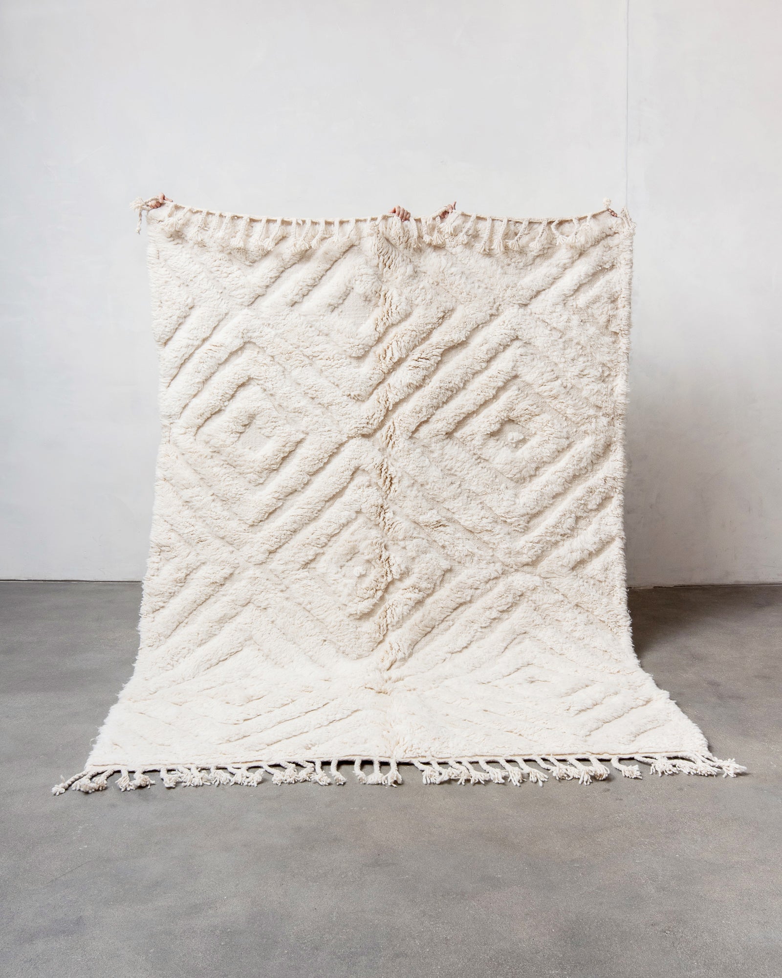 Modern, designer, handcrafted Berber rug from Morocco. Beniourain carpet with minimalist design, natural wool pile and a fluffy texture.