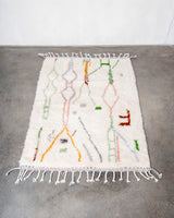 Modern, designer, handcrafted Berber rug from Morocco. Beniourain carpet with beautiful colours and patterns and fluffy wool texture. 