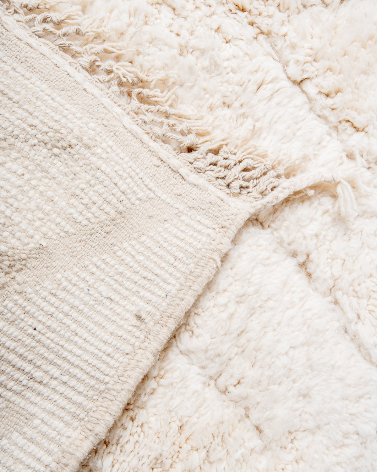 Modern, designer, handcrafted Berber rug from Morocco. Beniourain carpet with beautiful colours and patterns and fluffy wool texture.