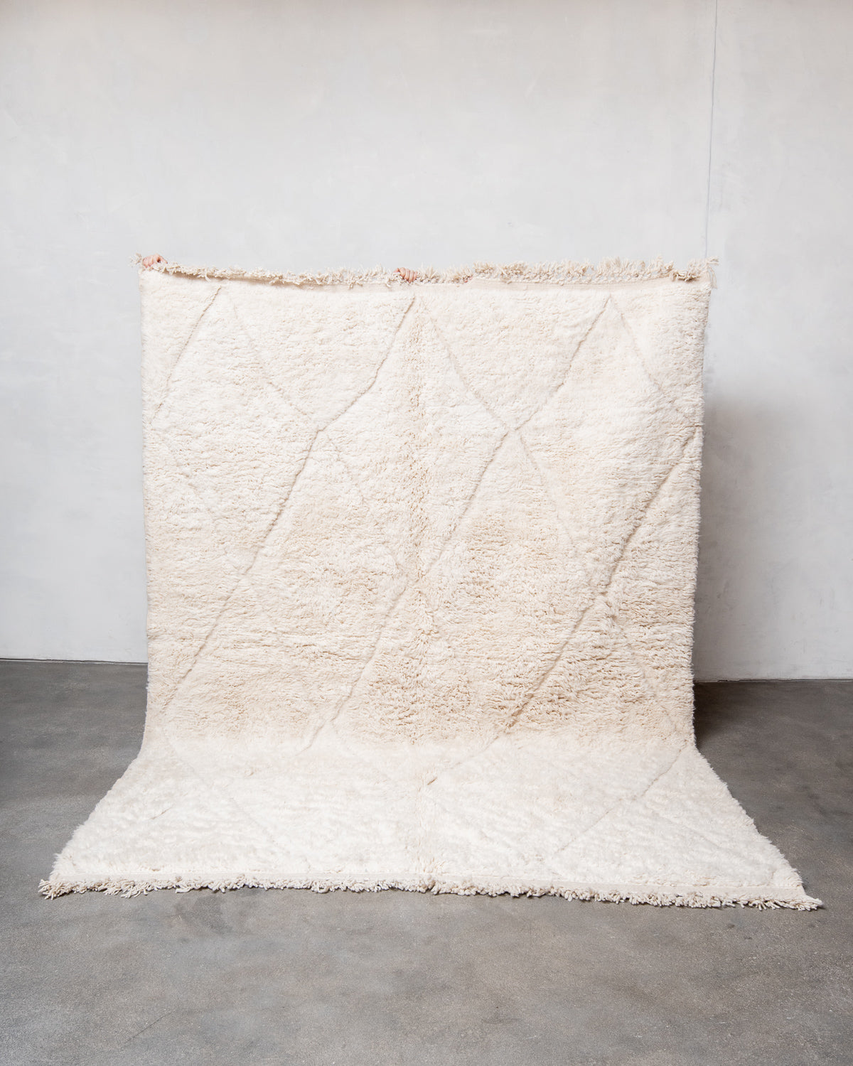 Modern, designer, handcrafted Berber rug from Morocco. Beniourain carpet with minimalist design, natural wool pile and a fluffy texture.