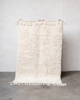Modern, designer, handcrafted Berber rug from Morocco. Beniourain carpet with minimalist design, natural wool pile and a fluffy texture.