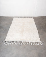 Modern, designer, handcrafted Berber rug from Morocco. Beniourain carpet with minimalist design, natural wool pile and a fluffy texture.
