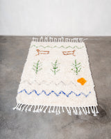 Modern, designer, handcrafted Berber rug from Morocco. Beniourain carpet with minimalist design, natural wool pile and a fluffy texture.