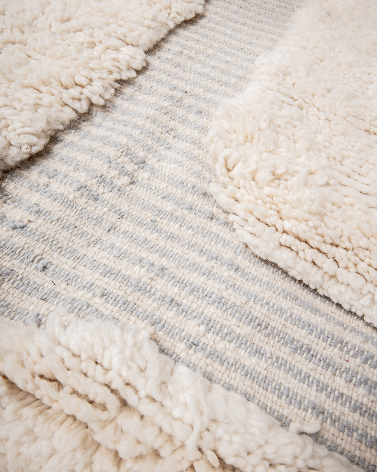 Modern, designer, handcrafted Berber rug from Morocco. Beniourain carpet with beautiful colours and patterns and fluffy wool texture.