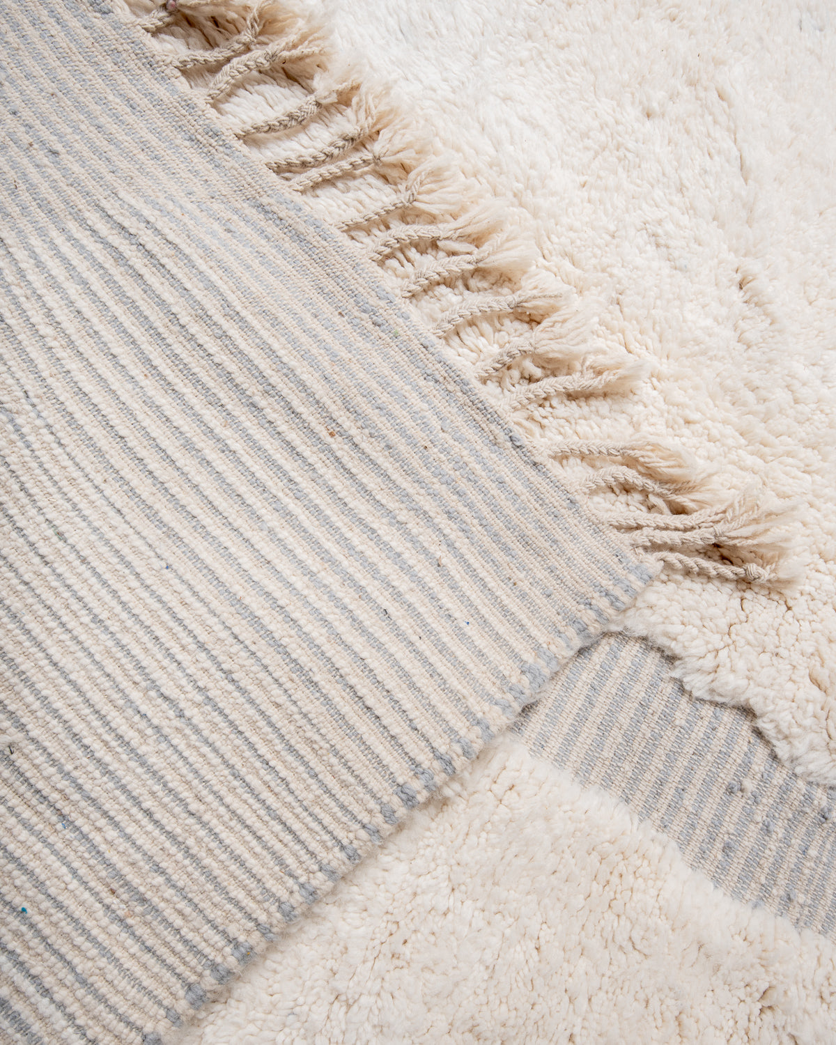 Modern, designer, handcrafted Berber rug from Morocco. Beniourain carpet with beautiful colours and patterns and fluffy wool texture.