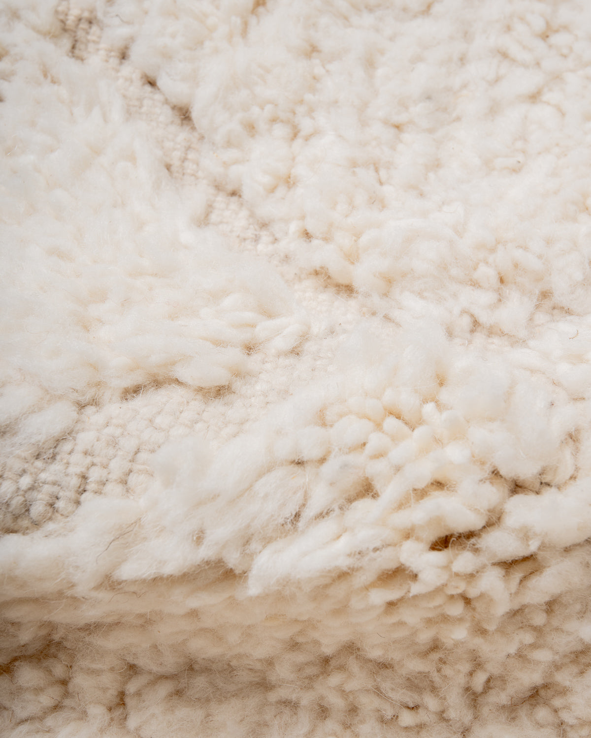 Modern, designer, handcrafted Berber rug from Morocco. Beniourain carpet with minimalist design, natural wool pile and a fluffy texture.