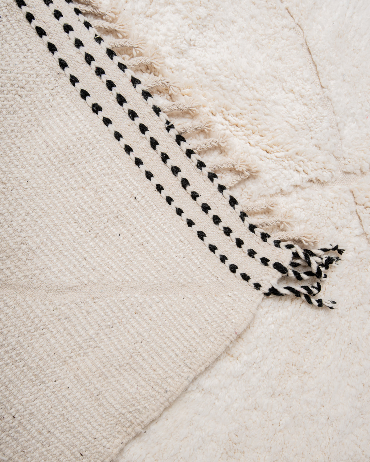 Modern, designer, handcrafted Berber rug from Morocco. Beniourain carpet with minimalist design, natural wool pile and a fluffy texture.