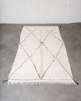 Modern, designer, handcrafted Berber rug from Morocco. Beniourain carpet with minimalist design, natural wool pile and a fluffy texture.