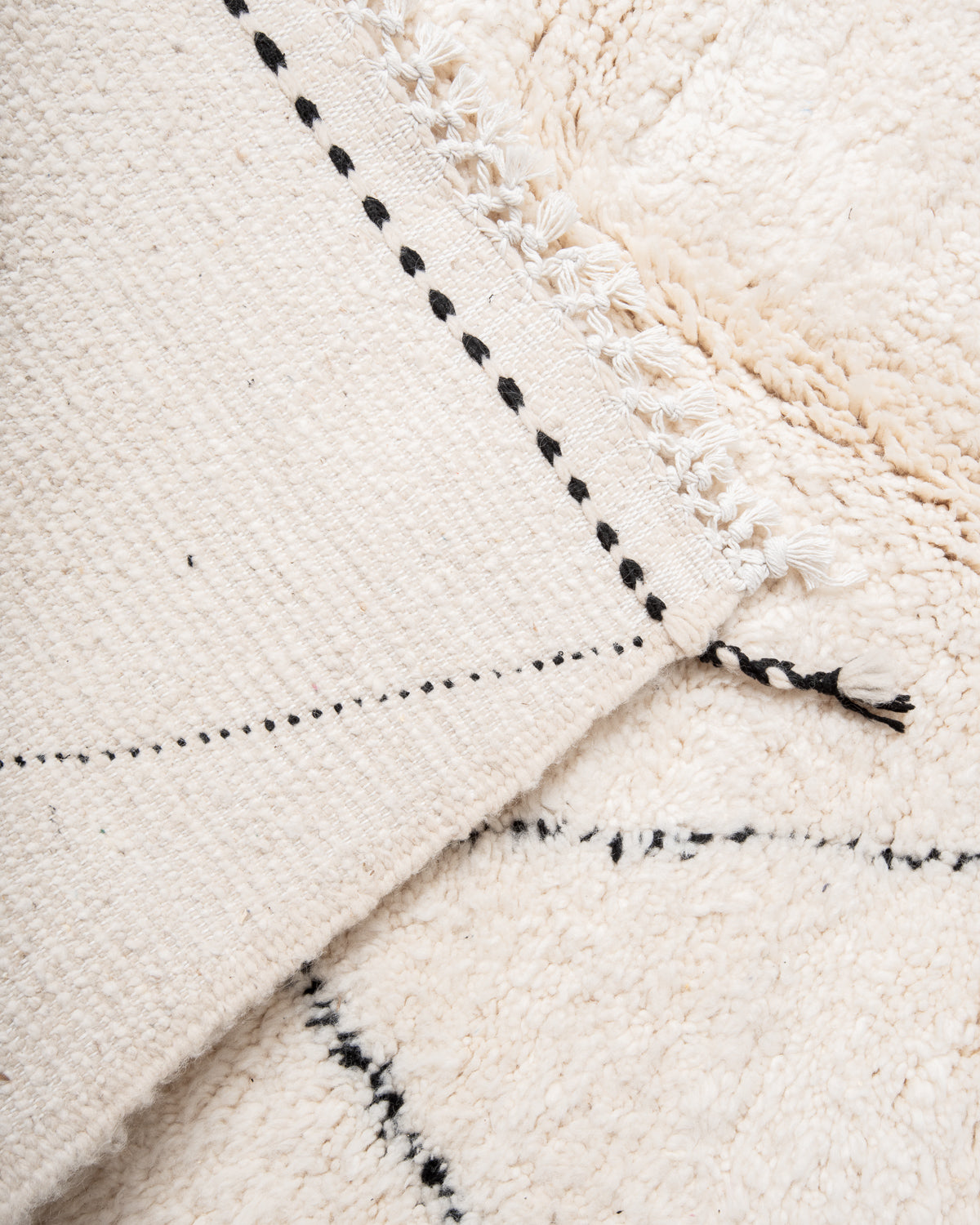 Modern, designer, handcrafted Berber rug from Morocco. Beniourain carpet with minimalist design, natural wool pile and a fluffy texture.