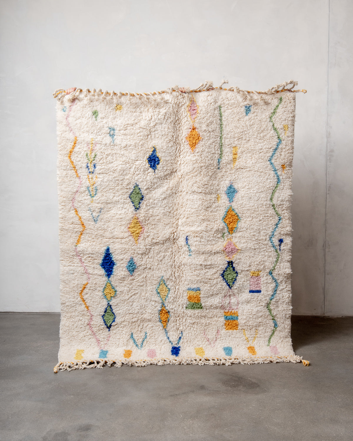 Modern, designer, handcrafted Berber rug from Morocco. Beniourain carpet with beautiful colours and patterns and fluffy wool texture.