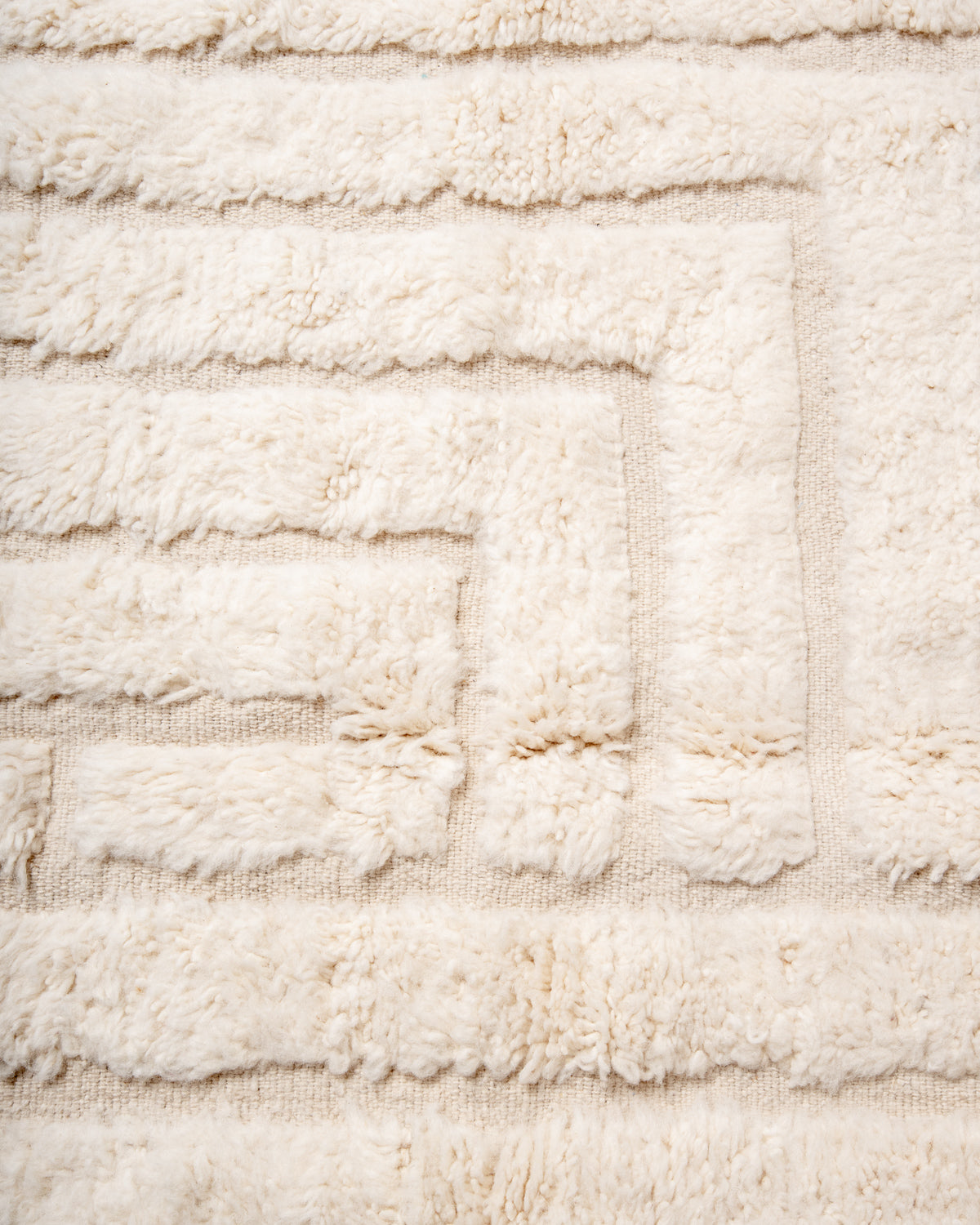 Modern, designer, handcrafted Berber rug from Morocco. Beniourain carpet with minimalist design, natural wool pile and a fluffy texture.