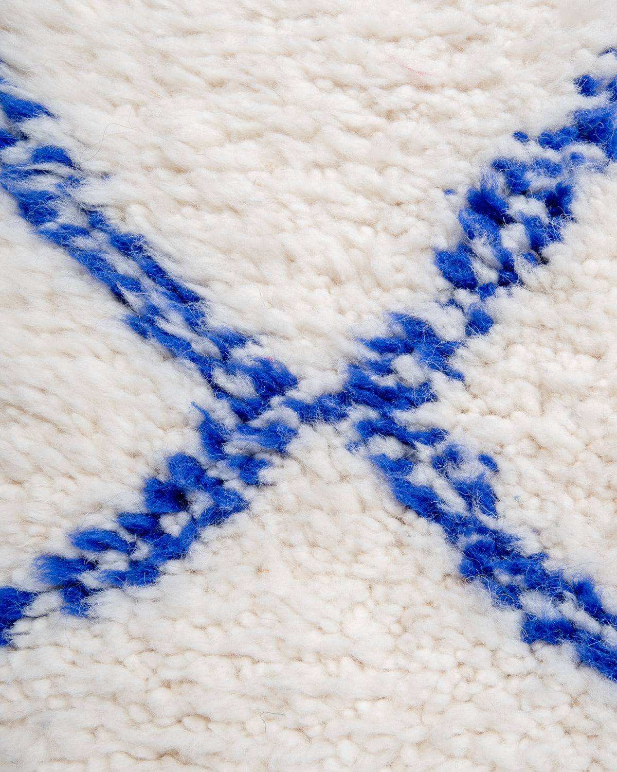 Modern, designer, handcrafted Berber rug from Morocco. Beniourain carpet with beautiful colours and patterns and fluffy wool texture.