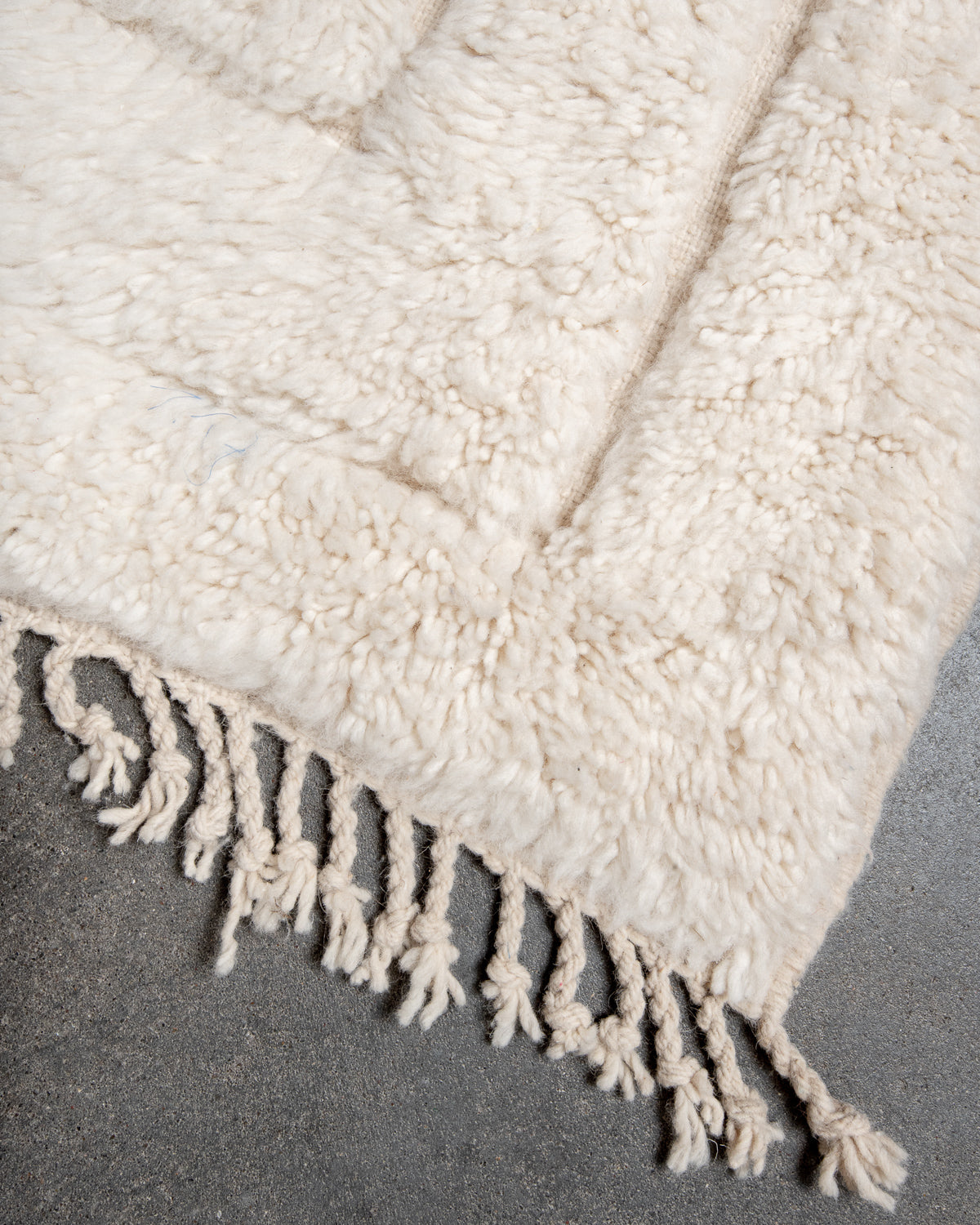 Modern, designer, handcrafted Berber rug from Morocco. Beniourain carpet with minimalist design, natural wool pile and a fluffy texture.