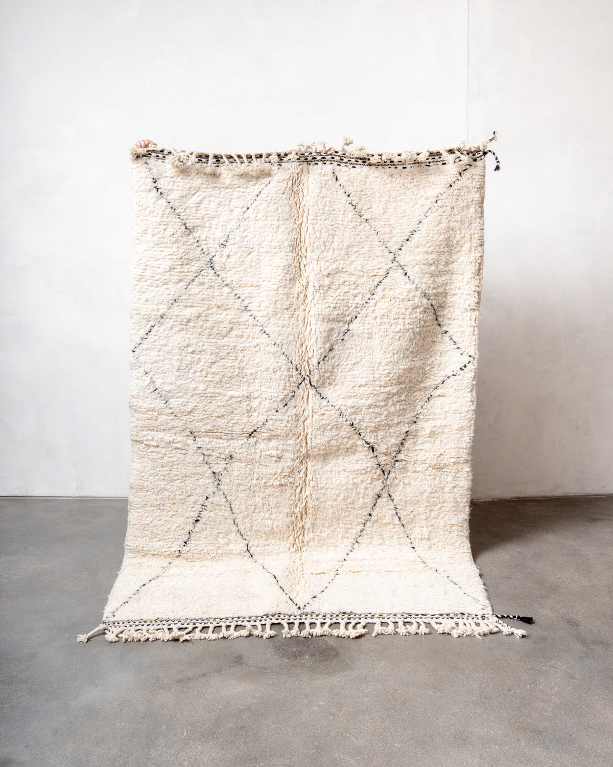 Modern, designer, handcrafted Berber rug from Morocco. Beniourain carpet with minimalist design, natural wool pile and a fluffy texture.