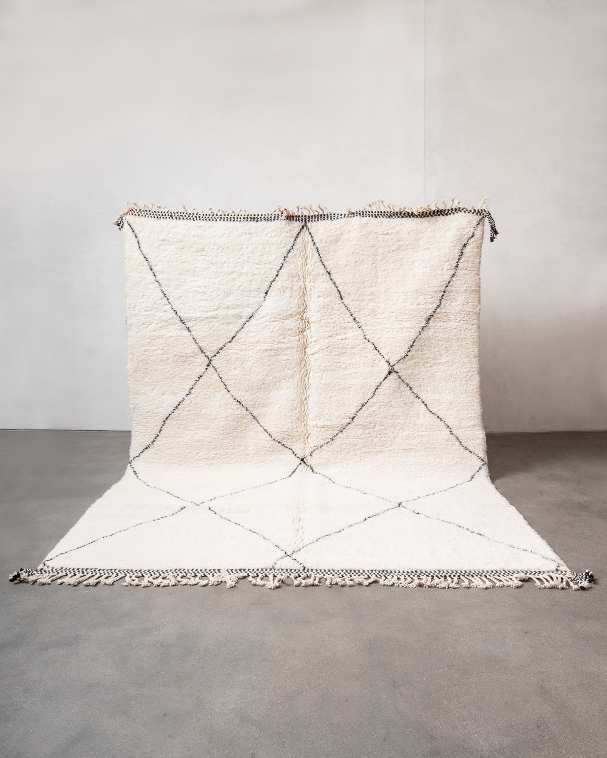 Modern, designer, handcrafted Berber rug from Morocco. Beniourain carpet with minimalist design, natural wool pile and a fluffy texture.