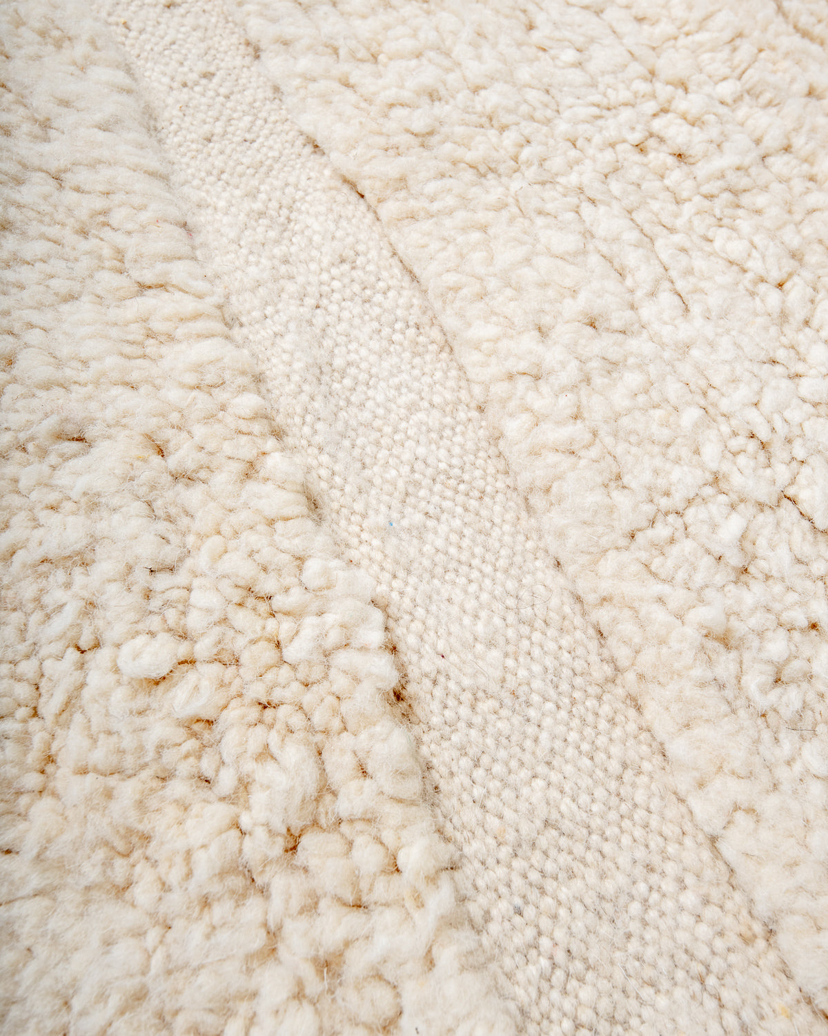 Modern, designer, handcrafted Berber rug from Morocco. Beniourain carpet with minimalist design, natural wool pile and a fluffy texture.