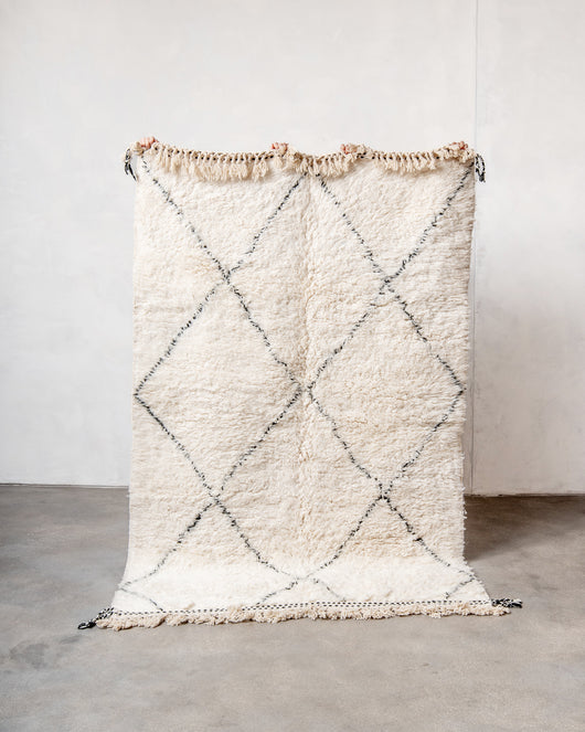 Modern, designer, handcrafted Berber rug from Morocco. Beniourain carpet with minimalist design, natural wool pile and a fluffy texture.