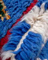 Modern, designer, handcrafted Berber runner rug from Morocco. Beniourain carpet with beautiful colours and patterns and fluffy wool texture.