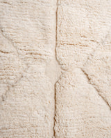 Modern, designer, handcrafted Berber rug from Morocco. Beniourain carpet with minimalist design, natural wool pile and a fluffy texture.