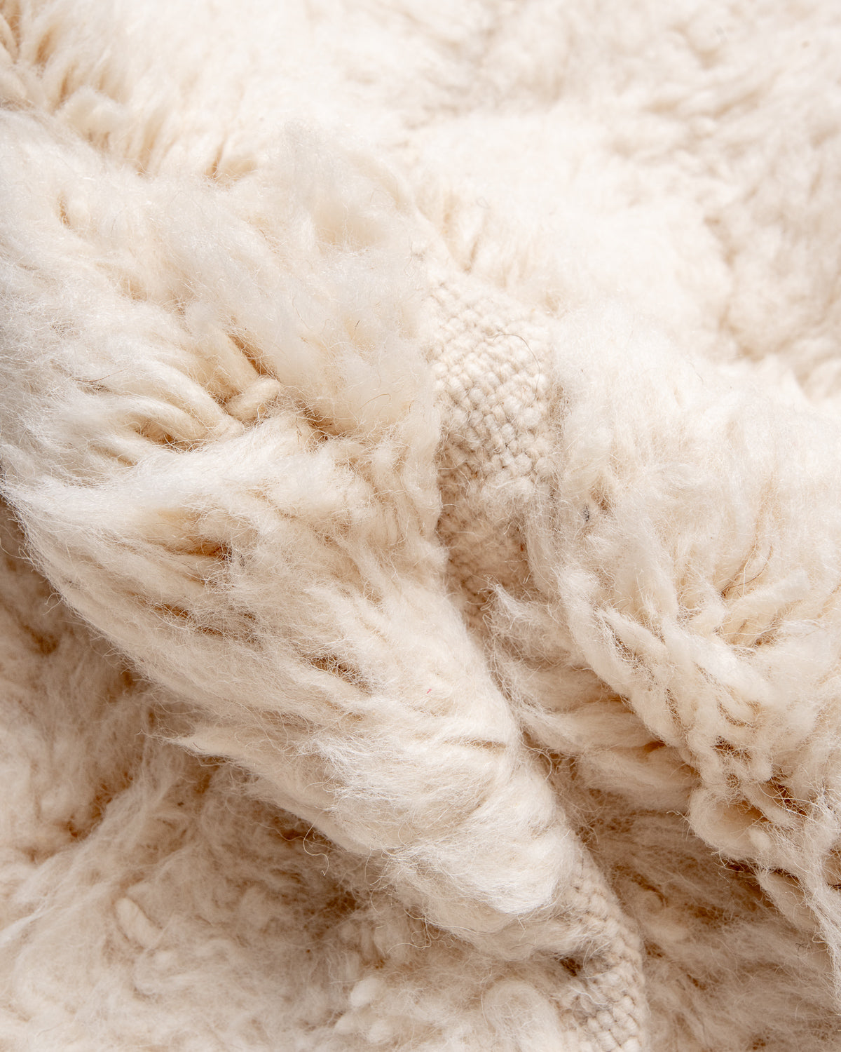 Modern, designer, handcrafted Berber rug from Morocco. Beniourain carpet with minimalist design, natural wool pile and a fluffy texture.