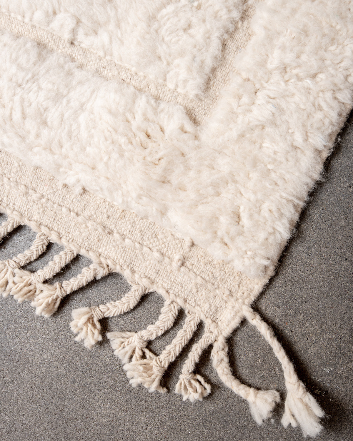 Modern, designer, handcrafted Berber rug from Morocco. Beniourain carpet with minimalist design, natural wool pile and a fluffy texture