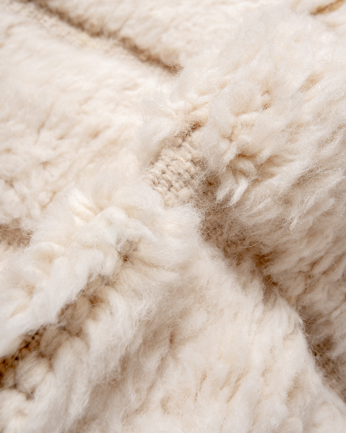 Modern, designer, handcrafted Berber rug from Morocco. Beniourain carpet with minimalist design, natural wool pile and a fluffy texture