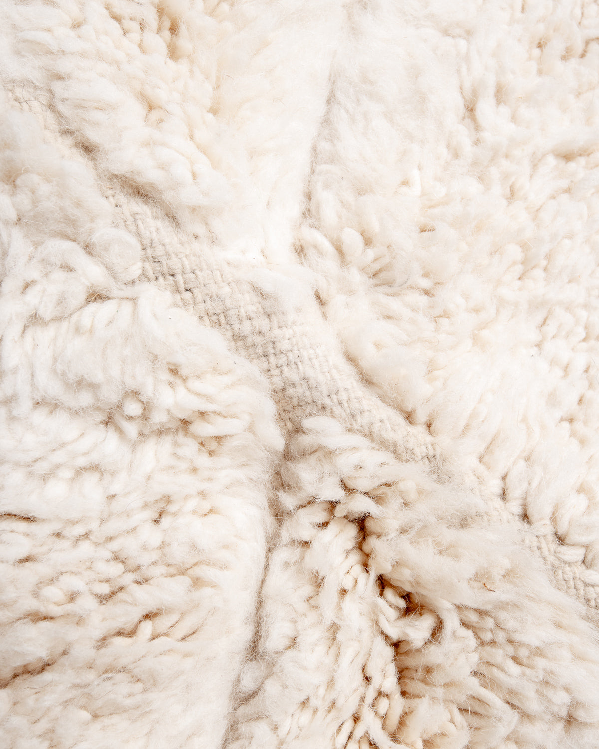 Modern, designer, handcrafted Berber rug from Morocco. Beniourain carpet with minimalist design, natural wool pile and a fluffy texture