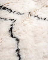 Modern, designer, handcrafted Berber rug from Morocco. Beniourain carpet with minimalist design, natural wool pile and a fluffy texture.